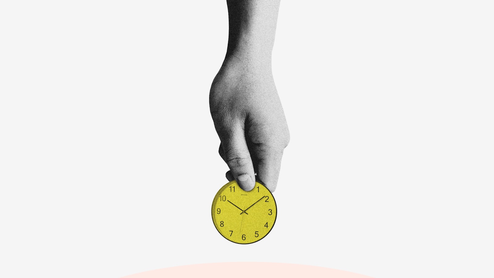 person holding yellow round analog clock